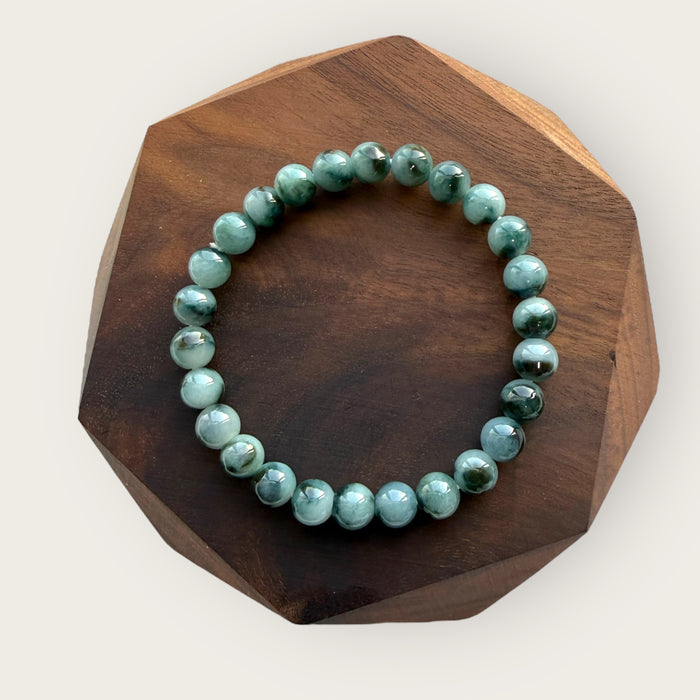 Dark Denim Blue Floating Flowers Jadeite Bead Bracelet