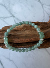 Dreamy Jade bracelet featuring smooth green jade beads and two hand-carved jade butterfly charms with silver spacers.