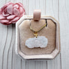 Dreamy Jade white carved floral jade pendant necklace with a gold leaf bail and box chain in a velvet jewellery box.