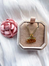 Dreamy Jade carved amber and earthy tone jade pendant necklace with gold-tone floral setting on a box chain