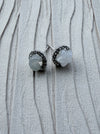 Dreamy Jade celestial stud earrings featuring a moon and star design in white jade-style stone and sterling silver.