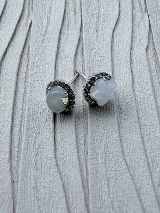 Dreamy Jade celestial stud earrings featuring a moon and star design in white jade-style stone and sterling silver.