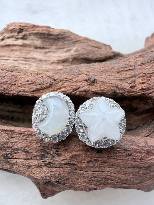 Dreamy Jade celestial stud earrings featuring a white jade moon and star with cubic zirconia halos in sterling silver.