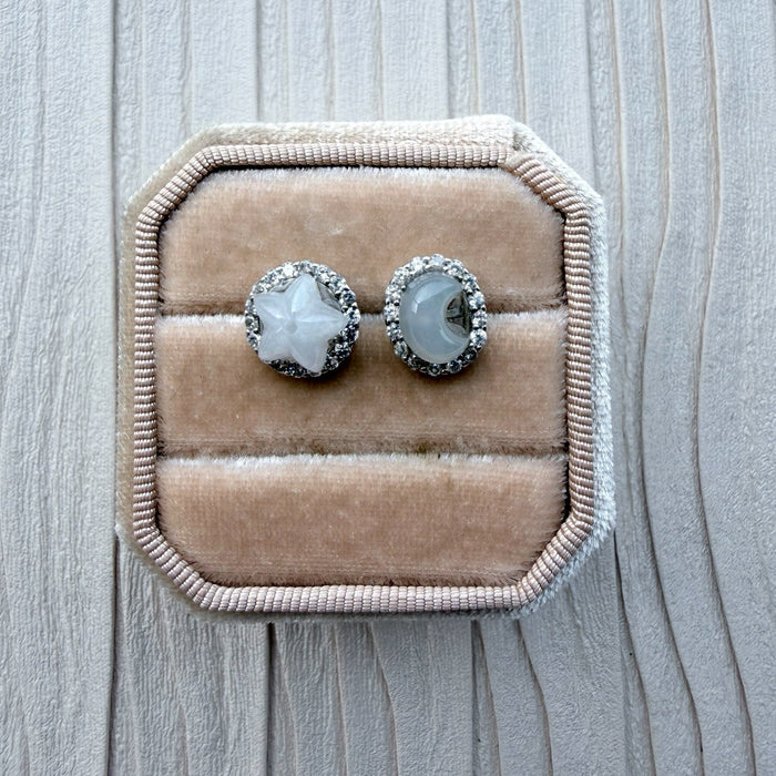 Dreamy Jade celestial stud earrings with white jade star and moon motifs, cubic zirconia halo, and sterling silver.
