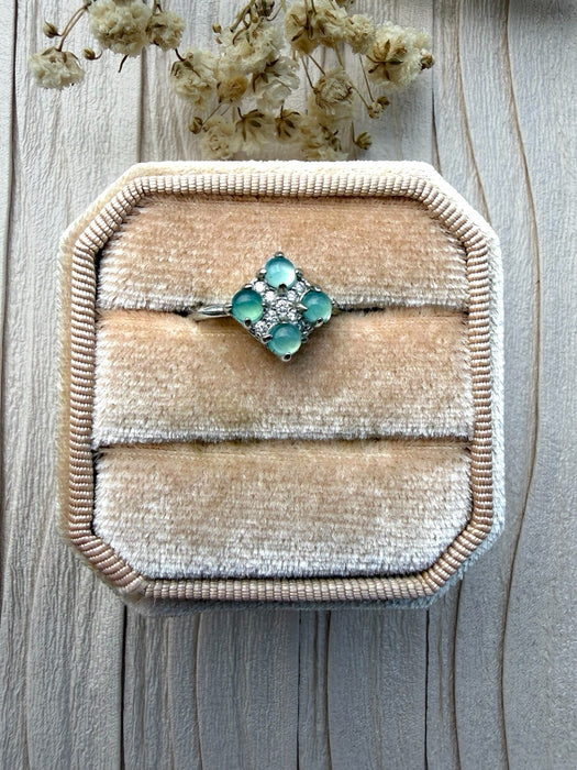 Dreamy Jade clover-inspired ring featuring mint green jade stones and sparkling accents in a silver setting