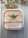 Dreamy Jade clover ring featuring vibrant green jade stones set in polished silver, displayed in a velvet ring box.