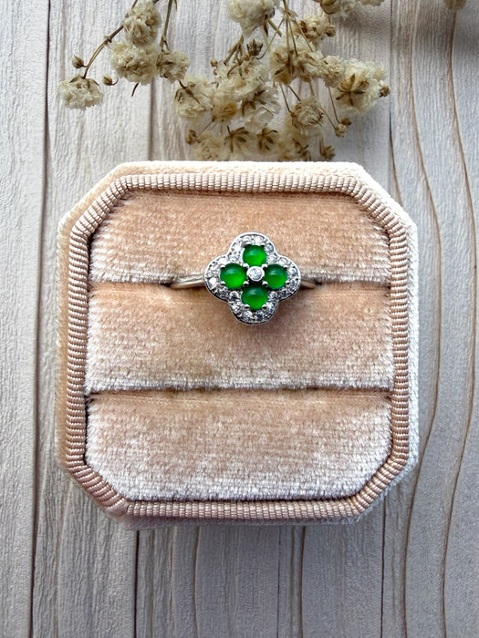 Dreamy Jade clover ring featuring vibrant green jade stones and sparkling crystals set in polished silver on a velvet box