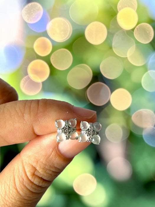 Dreamy Jade clover stud earrings with cabochon jade stones and pavé crystals set in polished silver-tone metal