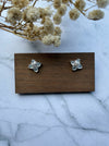 Dreamy Jade floral stud earrings featuring four cabochon jade stones in a clover motif with pavé crystal accents