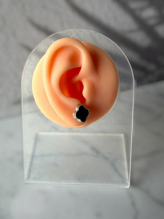 Dreamy Jade clover stud earrings featuring a dark green stone inlay and a delicate beaded silver border on a display ear.