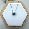 Dreamy Jade donut pendant necklace featuring a polished translucent green jade stone on a silver-tone chain