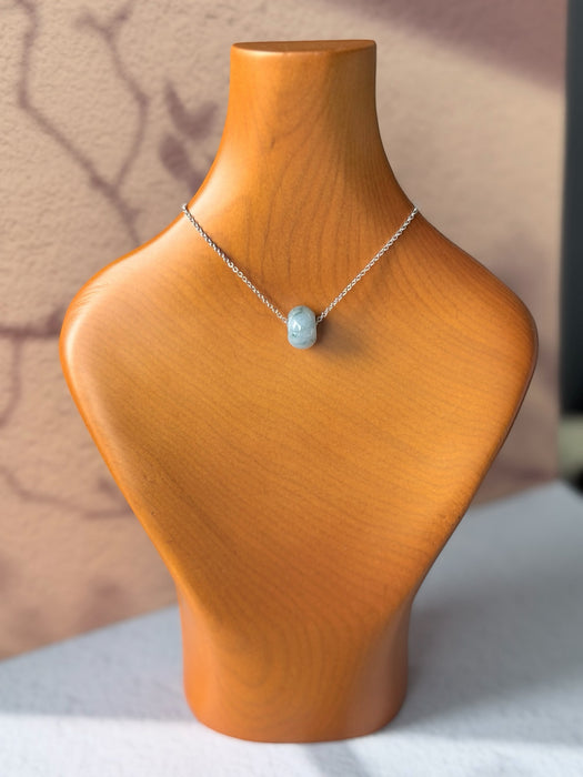 Dreamy Jade donut pendant necklace featuring a polished translucent green jade bead on a delicate silver-tone chain.