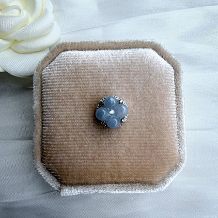 Dreamy Jade floral clover charm with icy-blue jade petals and a central accent stone set in polished sterling silver.