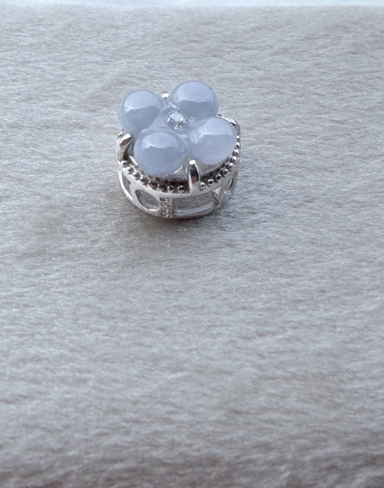 Dreamy Jade floral charm featuring icy-blue jade clover petals and a sparkling accent stone set in sterling silver.