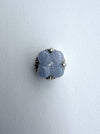 Dreamy Jade floral clover charm with icy-blue jade petals, a central accent stone, and sterling silver setting.
