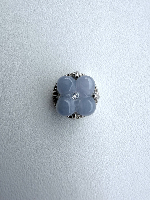 Dreamy Jade floral clover charm with icy-blue jade petals, a central accent stone, and sterling silver setting.