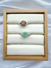 Dreamy Jade floral rings featuring carved green and amber jade flower gemstones on polished silver-tone bands.