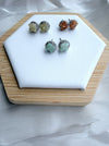 Dreamy Jade floral stud earrings featuring gemstone centres and crystal halos in green, orange, and pale yellow