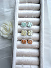 Dreamy Jade floral stud earrings in mint, pale yellow, and peach gemstone with crystal halos in a velvet jewellery box
