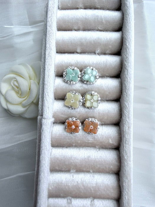 Dreamy Jade floral stud earrings in mint, pale yellow, and peach gemstone with crystal halos in a velvet jewellery box