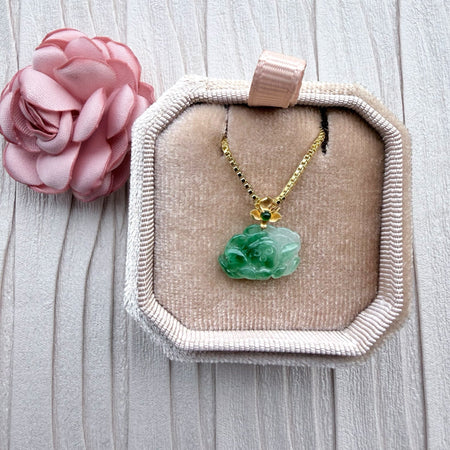 Dreamy Jade floral pendant necklace featuring carved green jade on a gold-tone box chain in a velvet jewellery box.