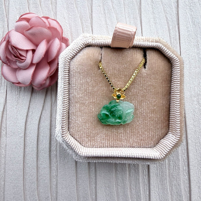 Dreamy Jade floral pendant necklace featuring carved green jade on a gold-tone box chain in a velvet jewellery box.