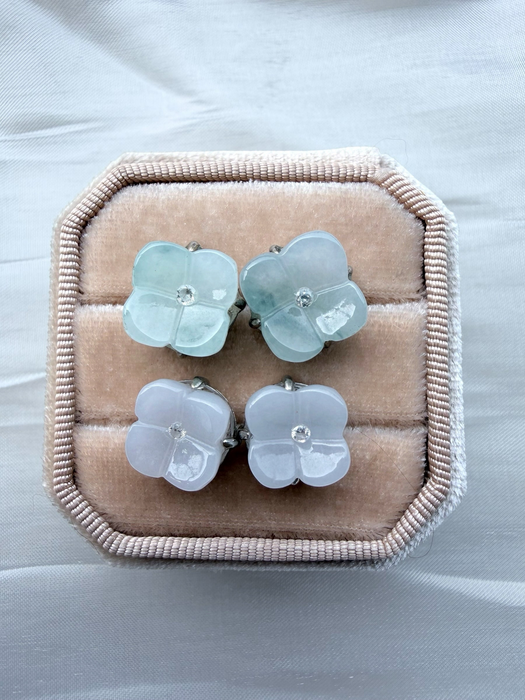 Dreamy Jade floral stud earrings featuring carved light green and lavender jade petals with a central sparkling stone.