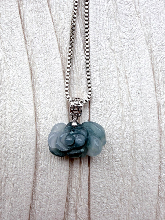 Dreamy Jade floral pendant necklace featuring a carved natural green jade rose on a polished silver box chain.