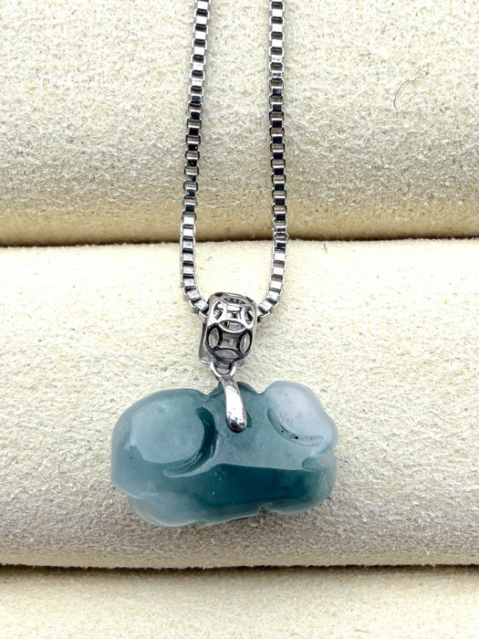 Dreamy Jade pendant necklace featuring a carved deep green natural jade stone on a silver box chain