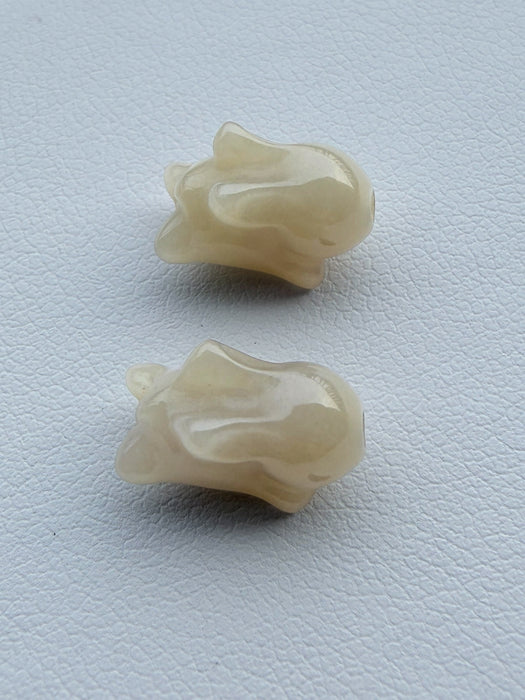 Dreamy Jade hand-carved off-white rabbit beads with a smooth polished finish for jewellery making