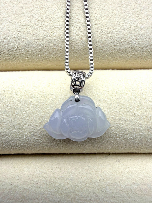 Dreamy Jade lavender jadeite pendant carved in a floral motif with a silver coin-inspired bail on a box chain.