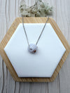 Dreamy Jade lavender jade pendant necklace with hand-carved floral motif on a minimalist silver-tone chain.