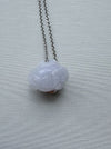 Dreamy Jade lavender jade pendant necklace featuring a hand-carved floral motif on a minimalist silver-tone chain.
