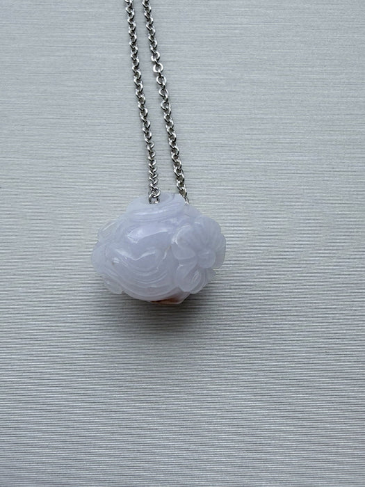 Dreamy Jade lavender jade pendant necklace featuring a hand-carved floral motif on a minimalist silver-tone chain.