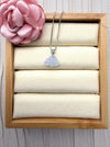 Dreamy Jade lavender jadeite floral pendant necklace on a silver box chain with a coin-inspired bail in a display box