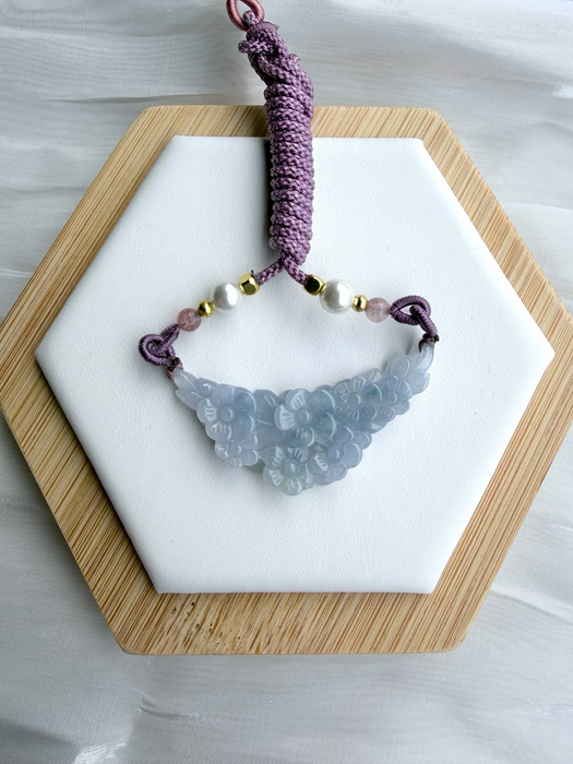 Dreamy Jade hand-carved icy-lavender jadeite floral pendant on a purple braided cord with pearls and gold accents.
