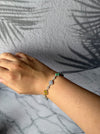 Dreamy Jade sterling silver bracelet featuring multi-coloured jade four-leaf clover charms worn on a wrist.