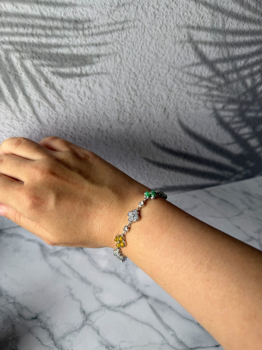 Dreamy Jade sterling silver bracelet featuring multi-coloured jade four-leaf clover charms worn on a wrist.