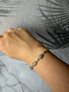 Dreamy Jade sterling silver link bracelet featuring multi-coloured green and yellow jade stones and cubic zirconia.