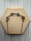 Dreamy Jade multi-coloured jade gemstone link bracelet with sterling silver chain and cubic zirconia accents.