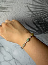 Dreamy Jade sterling silver link bracelet featuring multi-coloured green and yellow jade stones and cubic zirconia.