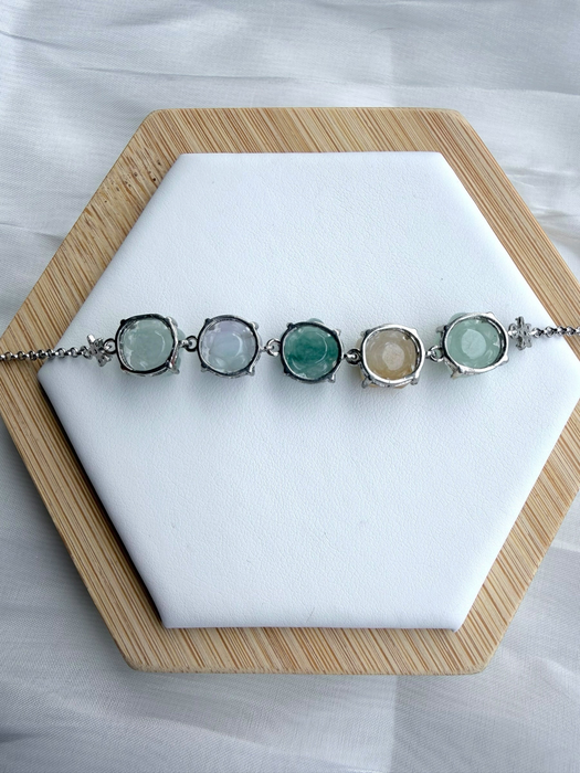 Dreamy Jade multi-coloured gemstone floral link bracelet with five unique jade beads in polished silver-tone settings.