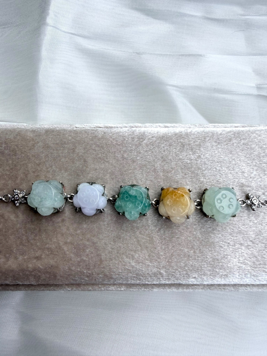 Dreamy Jade multi-coloured floral link bracelet featuring five carved jade gemstones in silver-tone settings.