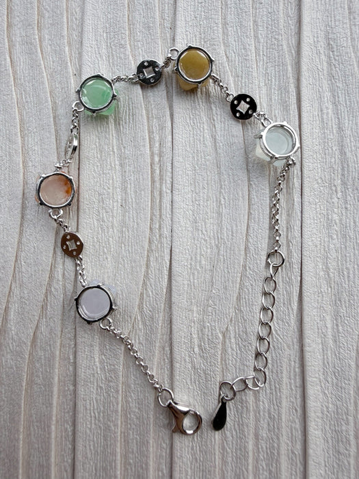 Dreamy Jade sterling silver chain bracelet featuring colourful star-shaped jade stones and prosperity coin charms.
