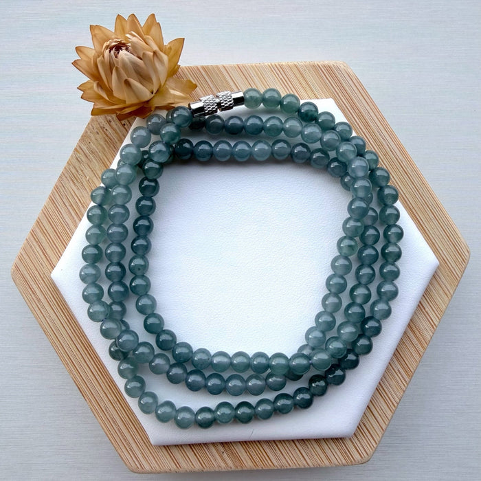 Dreamy Jade multi-strand bracelet featuring smooth translucent sea-green jade beads and a metallic magnetic clasp.