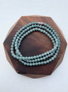 Dreamy Jade multi-strand bracelet featuring smooth translucent sea-green jade beads and a metallic magnetic clasp.