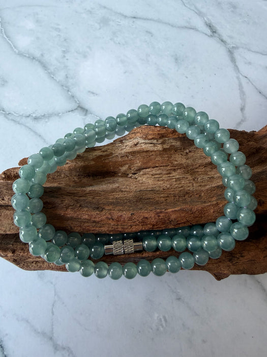 Dreamy Jade multi-strand bracelet featuring smooth translucent sea-green jade beads and a metallic magnetic clasp.