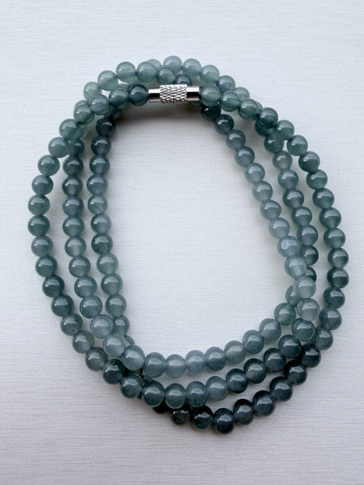 Dreamy Jade multi-strand bracelet featuring smooth sea-green jade beads and a polished metallic magnetic clasp.