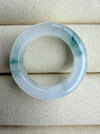 Dreamy Jade elegant natural jadeite ring band with translucent icy base and vibrant green splashes on velvet display