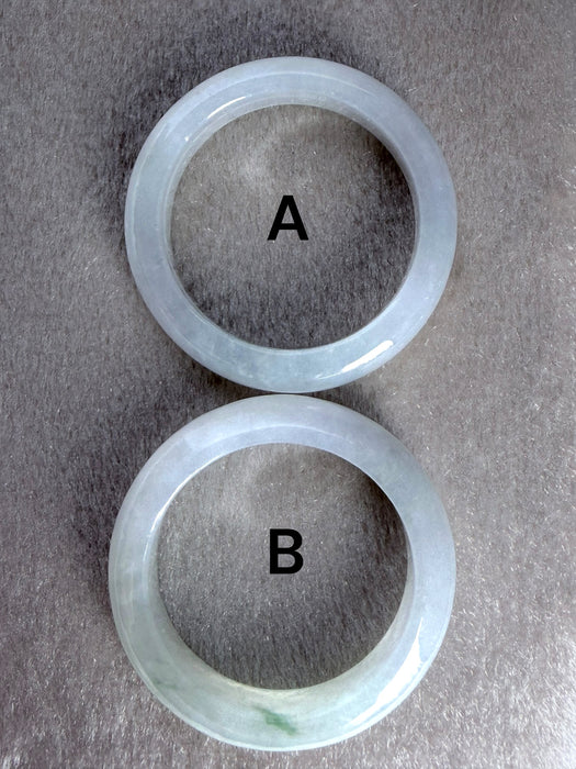 Dreamy Jade natural jadeite ring bands with smooth polished finish, showing two distinct green stone variations.